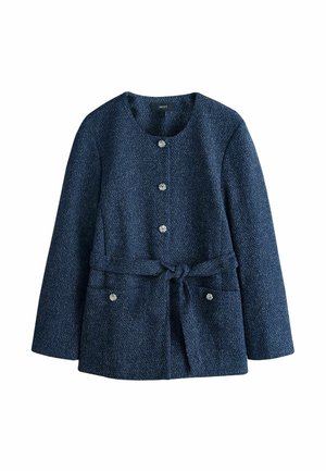 Tumesinist tekstuuriga jakk ümarate kaelustega, viie dekoratiivse nööbi, kahe esitasku ja lipsuga vöökohal istuva väljanägemise jaoks.