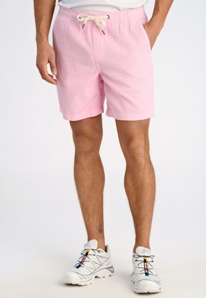 Helle rosa Cordshorts mit elastischem Bündchen und Kordelzug. Texturierte Oberfläche mit genähten Nähten und Seitentaschen.