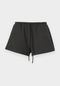 Black cotton shorts with an elastic waistband and drawstring, featuring a simple design and a soft texture. Short length and no patterns.