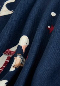 Fabric featuring a navy blue background with printed illustrations of swans, scarves, and red accents, showcasing a soft, textured surface.