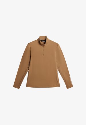 Braunes Langarmoberteil mit einem Halb-Reißverschluss-Kragen, gefertigt aus glattem Stoff. Mit einem dezenten Logo-Detail in Weiß auf dem Ärmel.