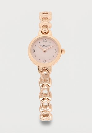 Orologio da polso Coach in oro rosa con quadrante rotondo, numeri semplici e cinturino a maglie, ore 10:09.