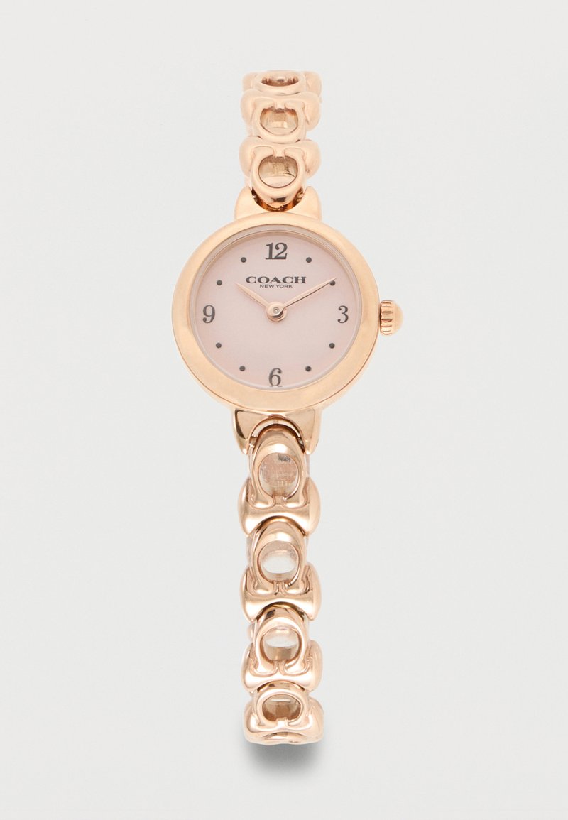 Montre-bracelet Coach en or rose avec cadran rond, index numériques simples et bracelet à maillons affichant 10h09.