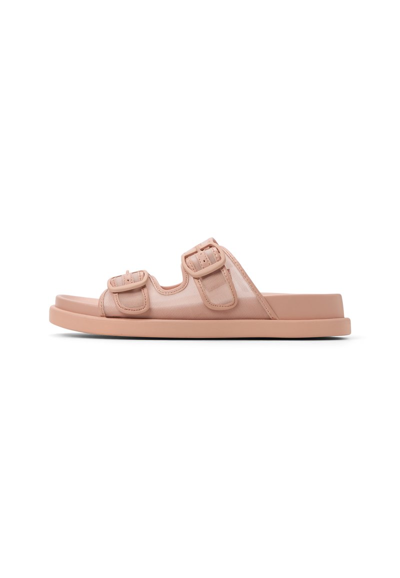Sandales à glissière roses avec deux boucles réglables, fabriquées à partir d'un matériau doux, dotées d'une semelle plate et d'une surface lisse et texturée.