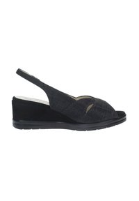 Sandali con zeppa slingback neri, dotati di una parte superiore in tessuto testurizzato, dettagli a forme ritagliate e una suola nera liscia. Presentano un tacco a zeppa stabile.