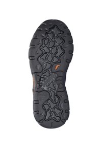 Zwarte rubberen buitenzool met een gestructureerd, gekarteld patroon. Voorzien van oranje accenten en verhoogde secties voor grip. Steady Grip merk zichtbaar.