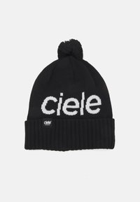 Black knitted beanie with a pom-pom on top, featuring white "ciele" text and a ribbed cuff. Includes a small black tag with white text.