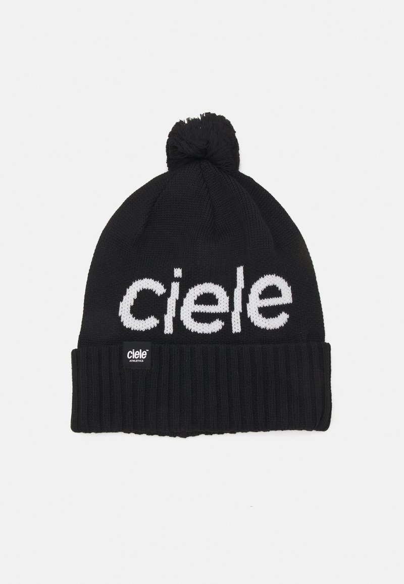 Black knitted beanie with a pom-pom on top, featuring white "ciele" text and a ribbed cuff. Includes a small black tag with white text.