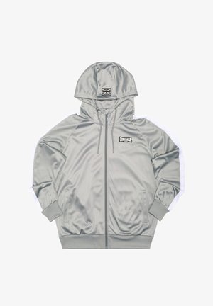 Hõbedane satiinist lukuga kapuutsiga dressipluus, valgete küljeribadega, esitaskutega ja logomärgiga, millel on Ühendkuningriigi lipp.