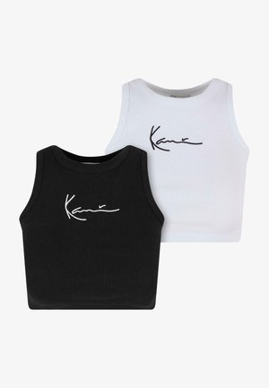 Fekete-fehér bordázott crop topok, kerek nyakkivágással és a jellegzetes "Kani" kézírással. Minden felső testhez simuló fazonú.