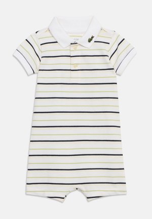 Lühikeste varrukatega valge beebibodie, millel on õhukesed horisontaalsed mustad ja helerohelised triibud, polosärk-krae, kaks nööpi ja väike krokodilli logo krael.