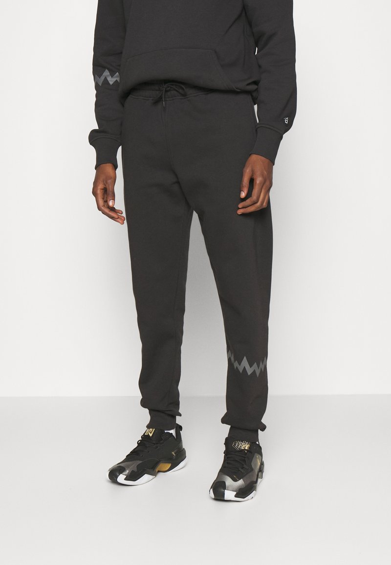 Puma HOOPS TEAM SWEAT PANT - Tracksuit bottoms - black - Zalando.co.uk