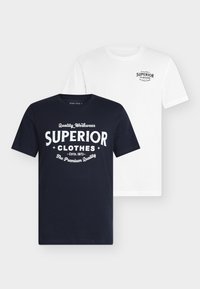 Two t-shirts: one navy blue with white graphic text, the other white with black text. Both are crew neck and short-sleeved.