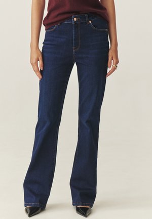 RIFONO - Flared Jeans - denim