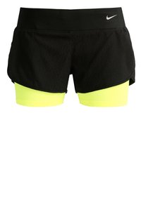 Shorts de sport noirs avec une couche intérieure ajustée jaune néon, dotés d'une taille haute et d'un petit logo Nike blanc sur le côté droit à l'avant.