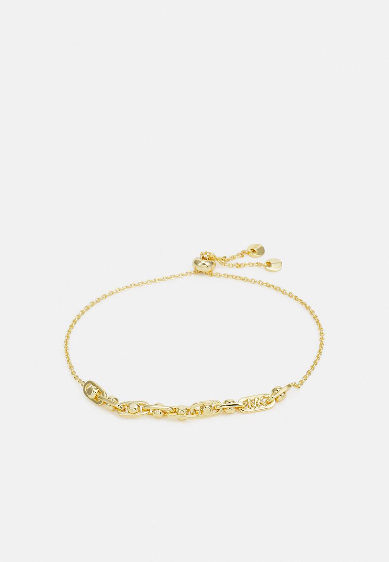 Bracciale in oro con maglie ovali e piccoli accenti sferici, chiusura a moschettone e catena di estensione regolabile.