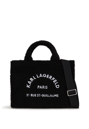 Black textured tote bag with two top handles and a detachable shoulder strap. Features white embroidered text "KARL LAGERFELD PARIS" and address.