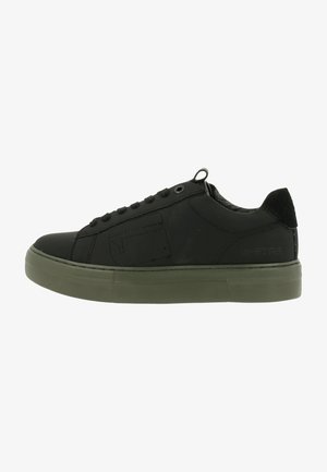 Black sneaker with a smooth textile upper, round toe, and a rubber olive green sole. Features a logo detail on the side and lace-up design.