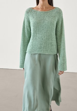 Stickad tröja - turquoise