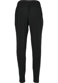 Sorte tætsiddende bukser med elastisk waistband, glat tekstur og syningsdetaljer. Letvægtsstof. Ingen synlige lommer eller udsmykninger.