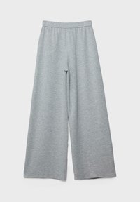 Pantalon de survêtement gris clair à jambes larges avec une taille élastique, tissu doux et design simple, présenté à plat sur un fond blanc.