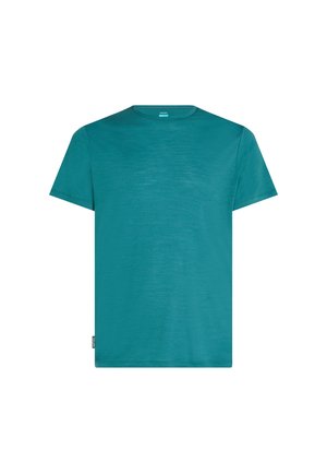 T-shirt a maniche corte di colore teal realizzato in tessuto leggero. Presenta un colletto a girocollo e un'etichetta piccola sul lato sinistro dell'orlo.