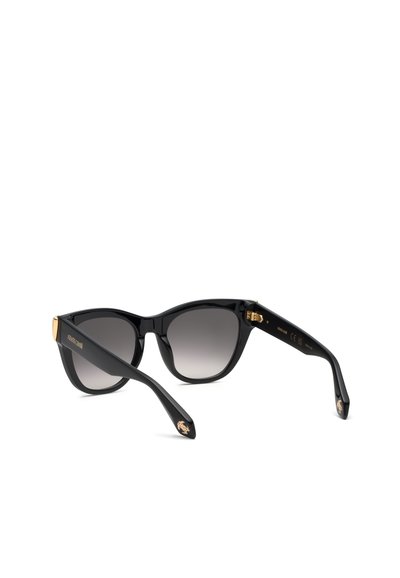 Lunettes de soleil œil de chat noires avec des verres dégradés foncés et des accents décoratifs dorés sur les branches et les embouts.