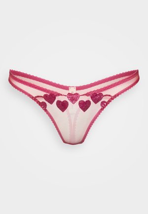 Pink mesh thong with scalloped edges. Adorned with shiny magenta heart appliqués. Features sheer panels and narrow straps.