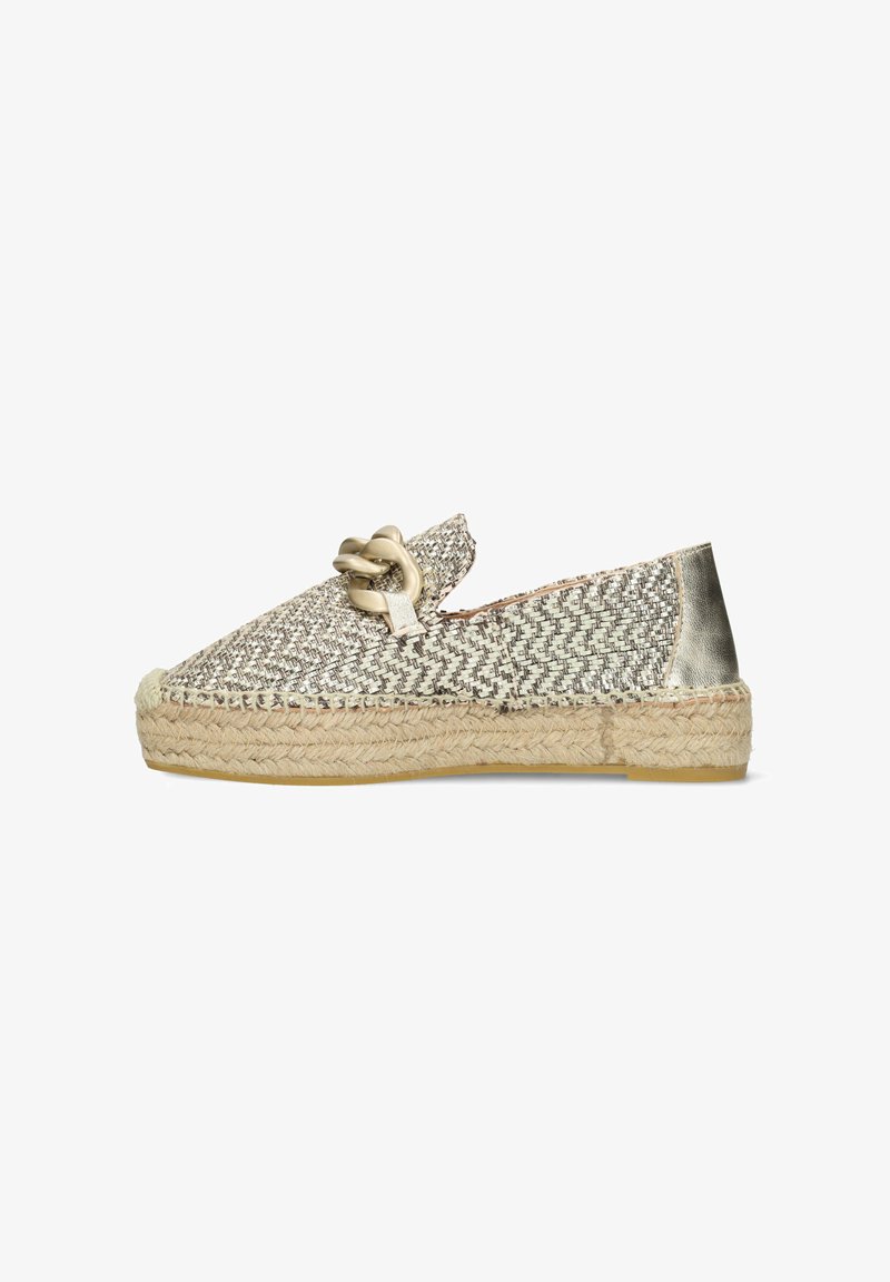 Espadrille-style shoe with a woven metallic upper in silver and gold hues, round toe, and jute rope sole. Notable decorative knot on the front.