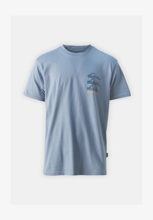 Light blue cotton t-shirt featuring a graphic on the left chest with layered mountain and wave designs in blue, orange, and black.