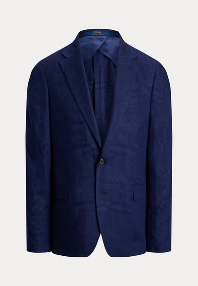 Navy blue blazer yang terbuat dari kain bertekstur, dilengkapi dengan kerah notch, penutupan satu kancing, dan dua kantong depan.