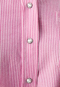 Striped shirt featuring pink and white vertical stripes, with silver buttons and a textured fabric. Detailing includes “ONLY” on the buttons.
