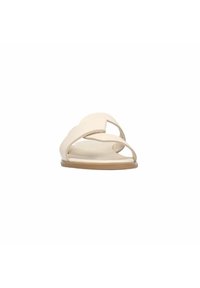 Light beige slide sandals with open toe design, textured upper, and smooth, flat sole. Minimalist style with soft curves in the strap design.