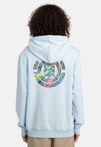 Light blue hoodie with a large, multicolored graphic on the back featuring tropical elements. Soft fabric, relaxed fit, and drawstring hood.