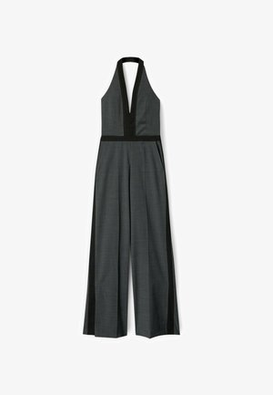 Grauer Jumpsuit mit Neckholder, tiefem V-Ausschnitt und schwarzen Seitenpaneelen. Verfügt über einen weit geschnittenen Beinverlauf und sichtbare Nahtdetails.