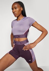 Puma STRONG BABY TEE SHORT - Sportfelső - pale plum