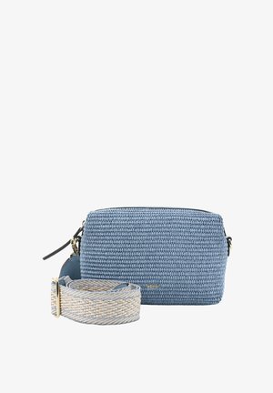 Blue woven bag with textured finish, featuring a black zipper and detachable patterned strap in beige and blue. Gold logo accent visible.