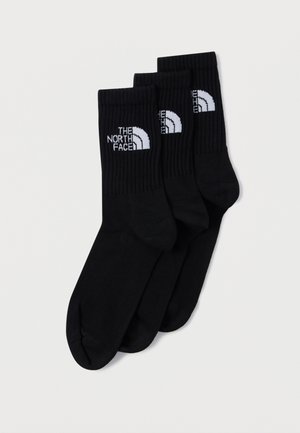 Set di calzini neri con polsini a coste, con il logo "THE NORTH FACE" in bianco. Realizzati in materiale morbido, progettati per comfort e durata.