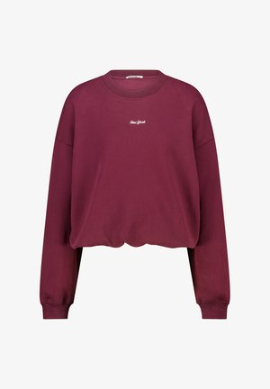 Burgundin vaaleat toppi pitkilla hihoilla, ribatilla hihansuilla ja valkoisella "New York" tekstillä brodeerattuna rintaan.