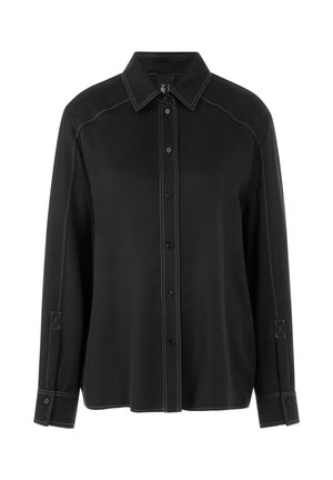 Black button-up shirt with contrasting beige stitching, long sleeves, a pointed collar, and square cuff accents. Features a relaxed fit.