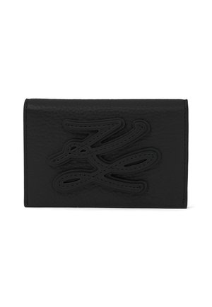 Black leather wallet with embossed abstract design centered on front flap, shown against a white background.