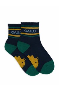 Calze blu marine con strisce verdi e gialle, dotate di una silhouette gialla di un animale sulla punta. Realizzate in tessuto morbido e strutturato.
