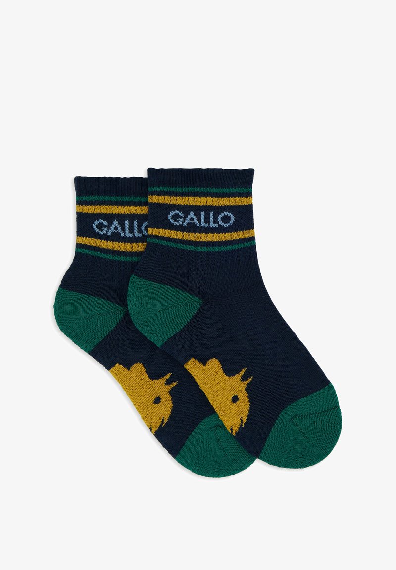 Navy socks with green and yellow stripes, featuring a yellow animal silhouette on the toe. Made from soft, textured fabric.