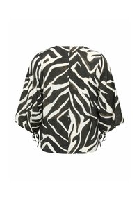 Blouse rayée zèbre noire et blanche avec manches larges et liens ajustables aux poignets, vue de dos sur fond blanc.