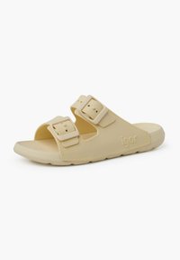 Infradito leggeri di colore beige chiaro, realizzati in materiale morbido, con due fibbie regolabili, design open-toe e soletta testurizzata per una migliore presa.