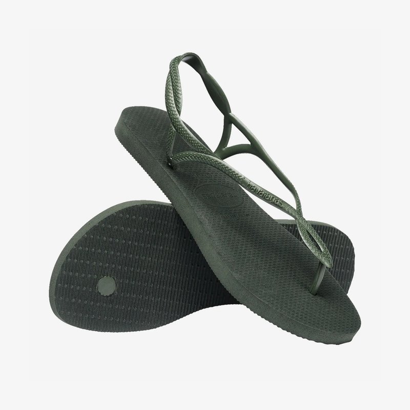 Flip-flops verzi din cauciuc cu tălpi texturate. Bretele subțiri, design împletit. Detaliu plat și circular pe talpă, logo embosat pe căptușeala piciorului.