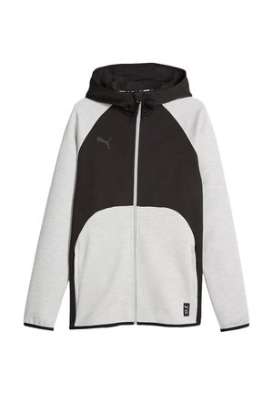 Chaqueta con capucha y cremallera, frontal negro y mangas gris claro, con logo de Puma en el pecho y pequeño parche cosido en el dobladillo.