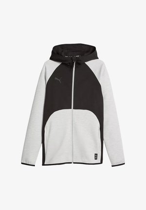Giacca con cappuccio e zip, parte frontale nera e maniche grigio chiaro, con logo Puma sul petto e piccola toppa cucita sull'orlo.