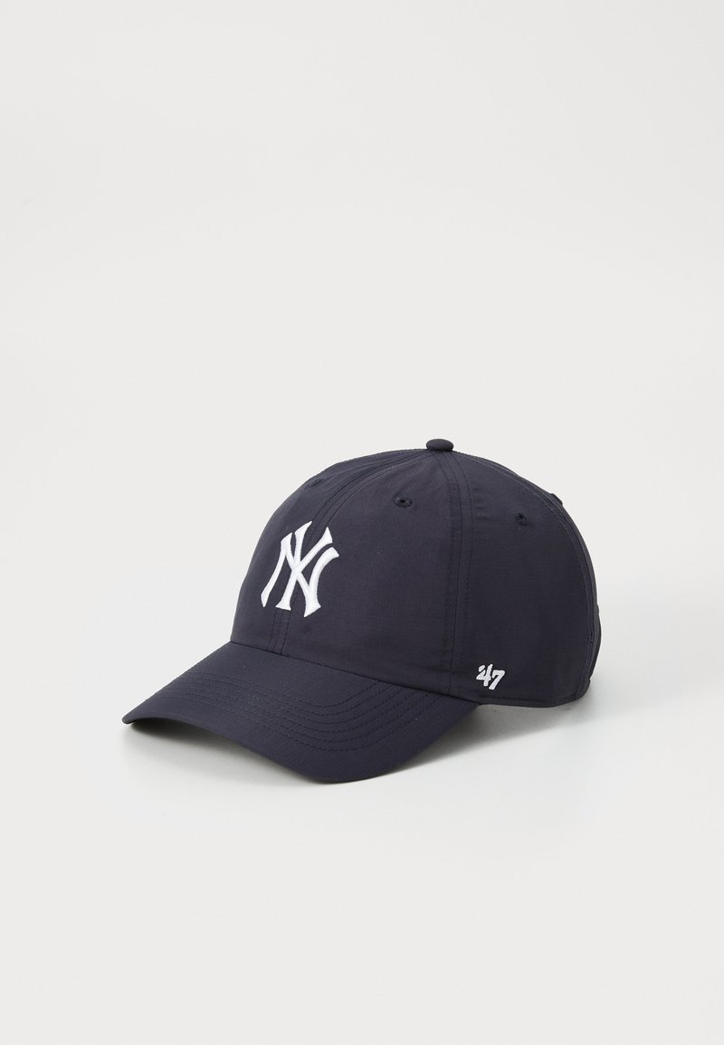 Navy blue baseball cap featuring a white embroidered NY logo on the front and a small white '47' logo on the side. Smooth fabric texture.