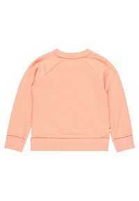 Felpa color pesca con maniche lungo raglan, tessuto testurizzato, polsini e orlo a costine. Presenta un piccolo logo sulla cucitura laterale.